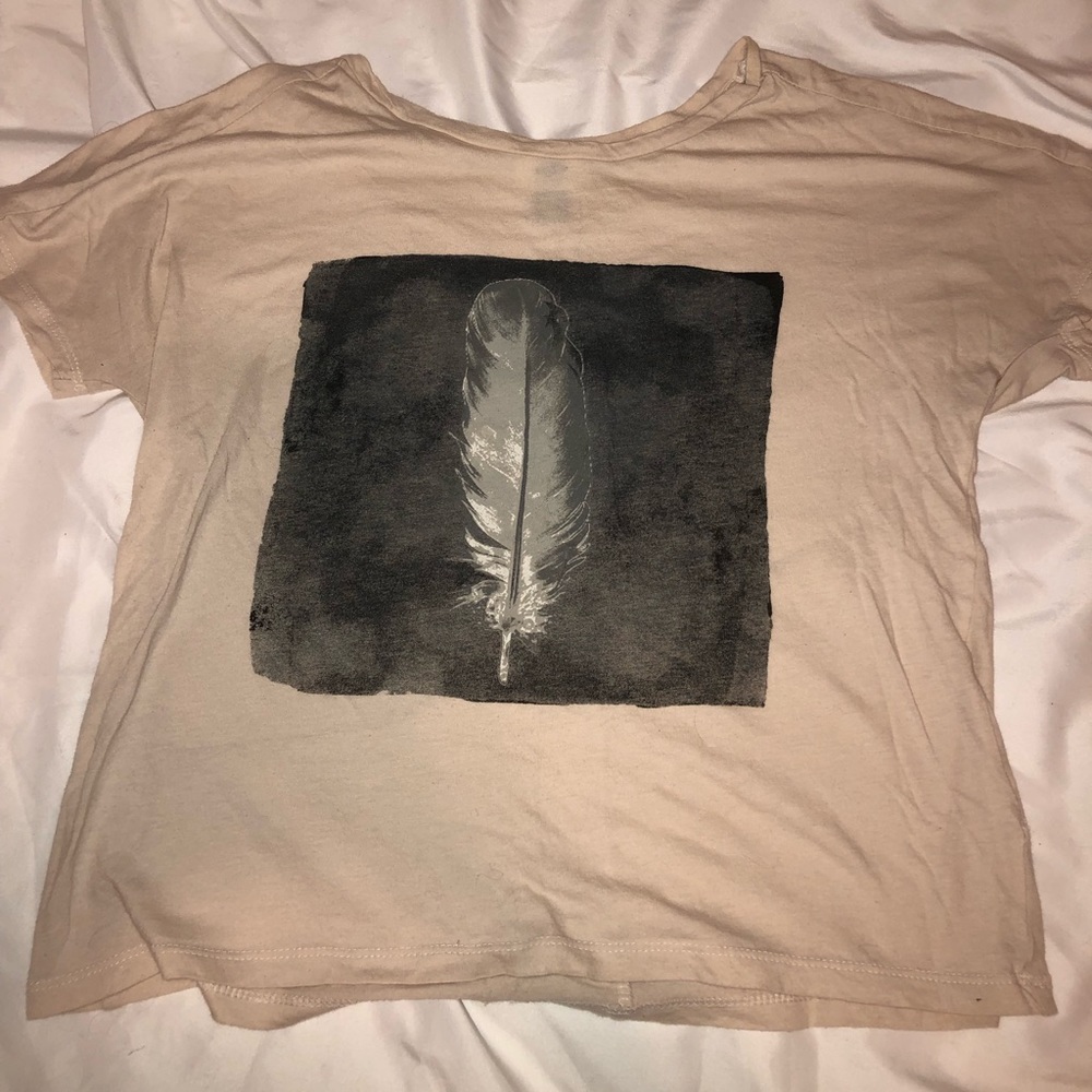 Tan shirt with feather